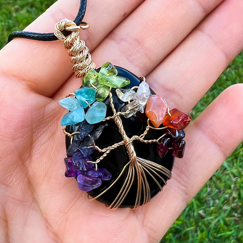    Black-Obsidia-Tree-Of-Life-Chakra-Necklace. Looking for a gift for mother/her, tree of life necklace, stone necklace, pendant? Shop at Magic Crystals for a 7 Chakra Tree Of Life Drop Necklace. 7 Chakra necklaces, and seven chakras jewelry pieces. Handmade Natural Amethyst Crystal. Amethyst Drop shape, teardrop, Protection Necklaces. 