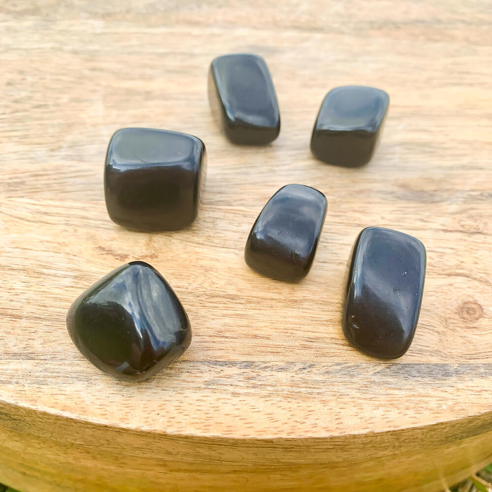 Looking for Black Obsidian? Enjoy FREE SHIPPING at Magic Crystals when you are looking for Black Obsidian TUMBLED MEDIUM - Tumbled Black Obsidian - Grounding Protection - Root Chakra - Base Chakra for Energy Healing. Black Obsidian is a very protective stone and is excellent for removing negativity. 