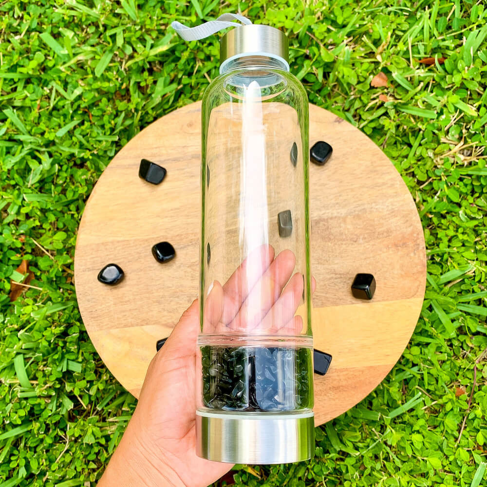    Black-Onyx-Gemstone. Looking for Authentic Tumbled Crystal Water Bottle | Glass and Stainless Steel Water Bottle? Shop at Magic Crystals for Crystal Bottle, Stone Infused, Elixir, Stainless Steel and Environmentally Friendly bottle. 400 - 500 ml Tumbled Gemstone Unique Mineral Collection Gift. Gem Elixir Water Bottle.