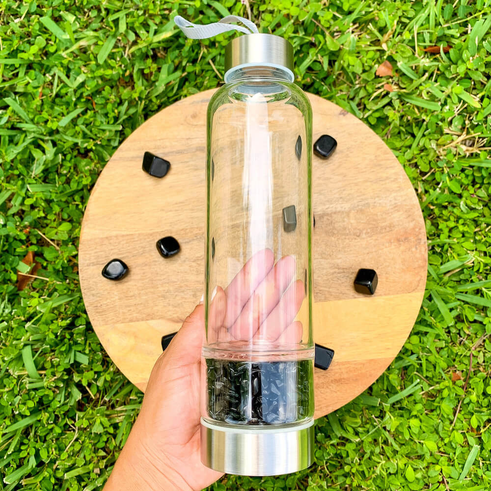    Black-Onyx-Gemstone. Looking for Authentic Tumbled Crystal Water Bottle | Glass and Stainless Steel Water Bottle? Shop at Magic Crystals for Crystal Bottle, Stone Infused, Elixir, Stainless Steel and Environmentally Friendly bottle. 400 - 500 ml Tumbled Gemstone Unique Mineral Collection Gift. Gem Elixir Water Bottle.