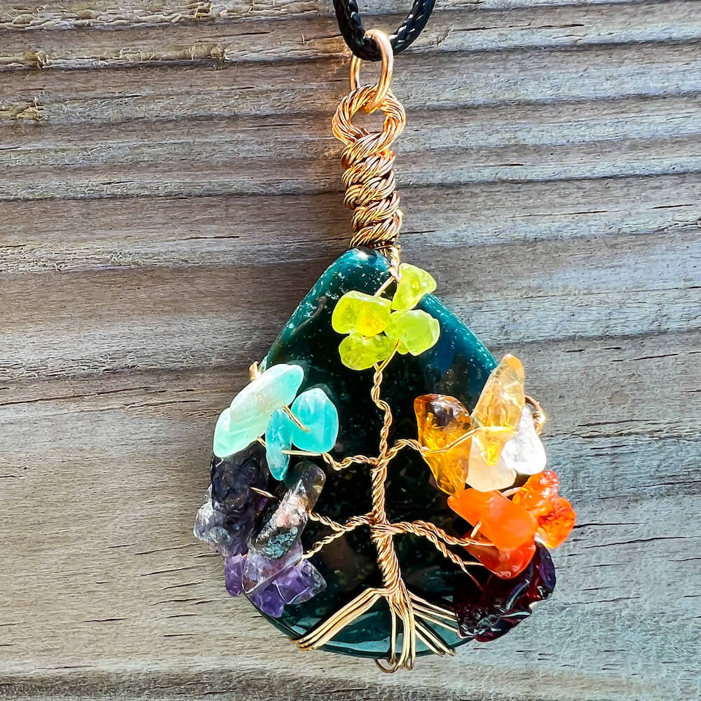 Bloodstone-Tree-Of-Life-Chakra-Necklace. Looking for a gift for mother/her, tree of life necklace, stone necklace, pendant? Shop at Magic Crystals for a 7 Chakra Tree Of Life Drop Necklace. 7 Chakra necklaces, and seven chakras jewelry pieces. Handmade Natural Amethyst Crystal. Amethyst Drop shape, teardrop, Protection Necklaces. 