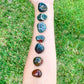 Buy Bloodstone Tumbled Stones | Bloodstone Polished Gemstones | Bulk Crystals at Magic Crystals. Bloodstone or Sanguinaria is an uplifting and protective. It facilitates clarity decision and boosts energy. FREE SHIPPING available.