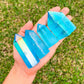 Looking for Blue Aqua Aura Raw obelisk at Magic Crystals for Blue aura quartz, aura quartz obelisk, blue crystal, crystal obelisk tower, aqua aura quartz. Blue to Pink Aura Quartz obelisk, Blue Aura Point, Pink Aura Quartz excellent for jewelry making. FREE SHIPPING available.