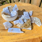 Blue Lace Agate Free Form - Blue Lace Agate Slabs Polished Gemstones | Bulk Crystals at Magic Crystals. Blue Lace Agate, also known as a healing stone, with a soft, cooling and calming energy. Helps bring peace of mind. Facilitates free expression of thoughts and feelings. FREE SHIPPING available.