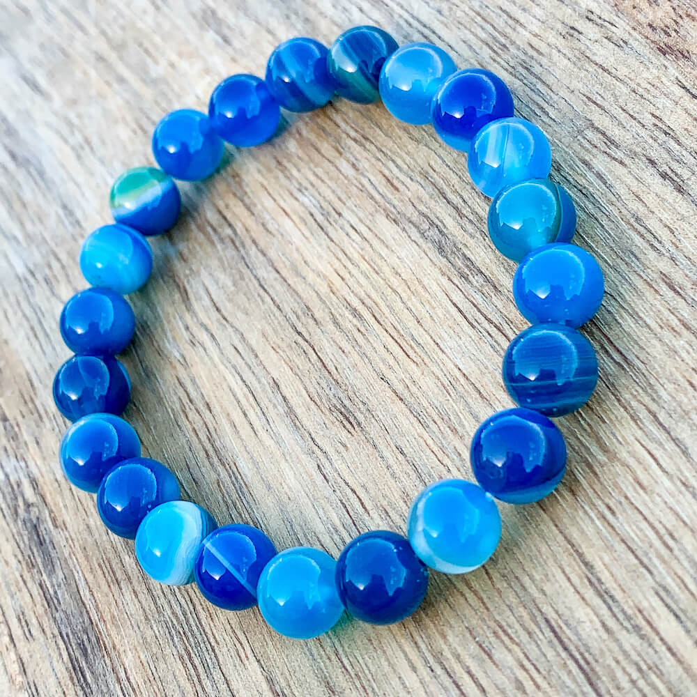 Blue onyx Bracelet. Onyx Empathetic, supporting, and glowing with soft. Natural Blue Onyx Smooth Round Beads available with FREE SHIPPING. Magic Crystals carries Blue onyx Jewelry. Healing Bracelet, Beaded Bracelet, Insomnia Bracelet, Gemstone Bracelets for Men. FREE SHIPPING available.