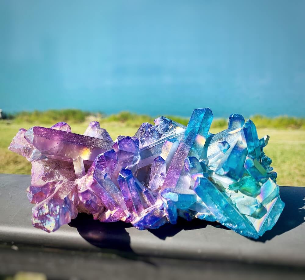 Shop for Aura Quartz cluster points. Purple Aura Crystal Point Aura Stone Flashy Rainbow Aura Crystal Point at Magic Crystals. Blue Aqua Aura & Purple Aura Quartz Cluster 374 grams at magiccrystals.com are Clear Quartz bonded with Platinum which results in a lovely raspberry rose, blue, and a purple metallic sheen.