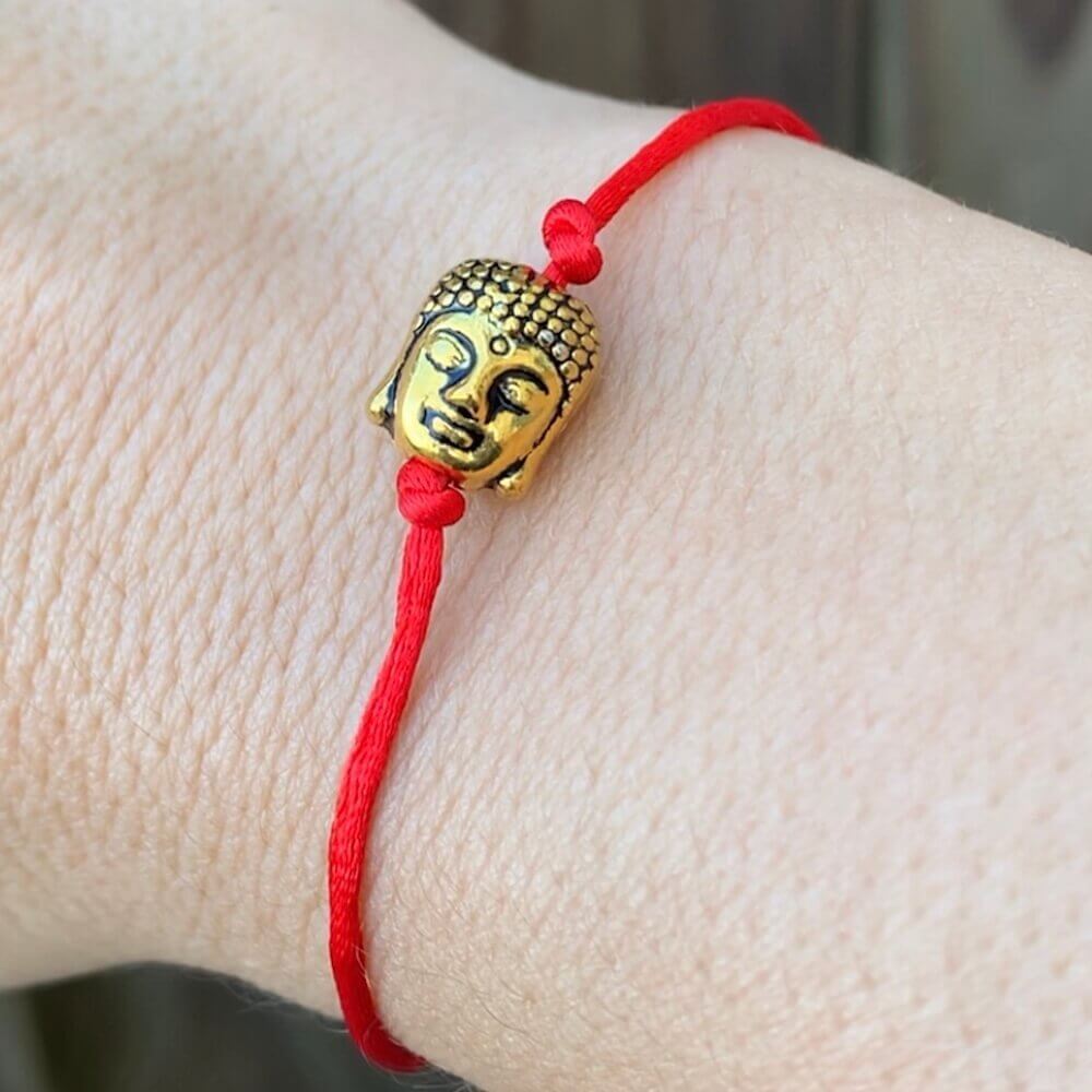 Golden-Buddha-Protection-Bracelet.Shop at Magic Crystals for Protection. The Red String Bracelet has been worn throughout history in many cultures as a symbol of protection, faith, and good luck and acts as a shield from negativity and actually has many positive effects. In quite a few cultures a red string bracelet is believed to have magical powers.