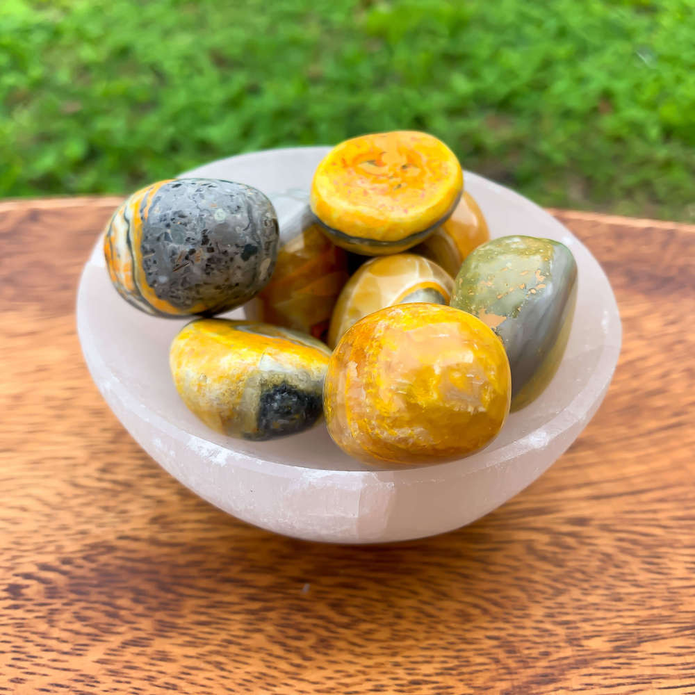 Looking for genuine bumble bee jasper? Magic Crystals carries Tumbled Bumblebee Jasper. This is one summertime Bumble Bee Jasper Tumbled Stone.  bumble bee jasper, polished jasper, bumble bee jasper tumble, tumbled stones, tumbled crystals. FREE SHIPPING available.