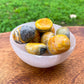 Looking for genuine bumble bee jasper? Magic Crystals carries Tumbled Bumblebee Jasper. This is one summertime Bumble Bee Jasper Tumbled Stone.  bumble bee jasper, polished jasper, bumble bee jasper tumble, tumbled stones, tumbled crystals. FREE SHIPPING available.