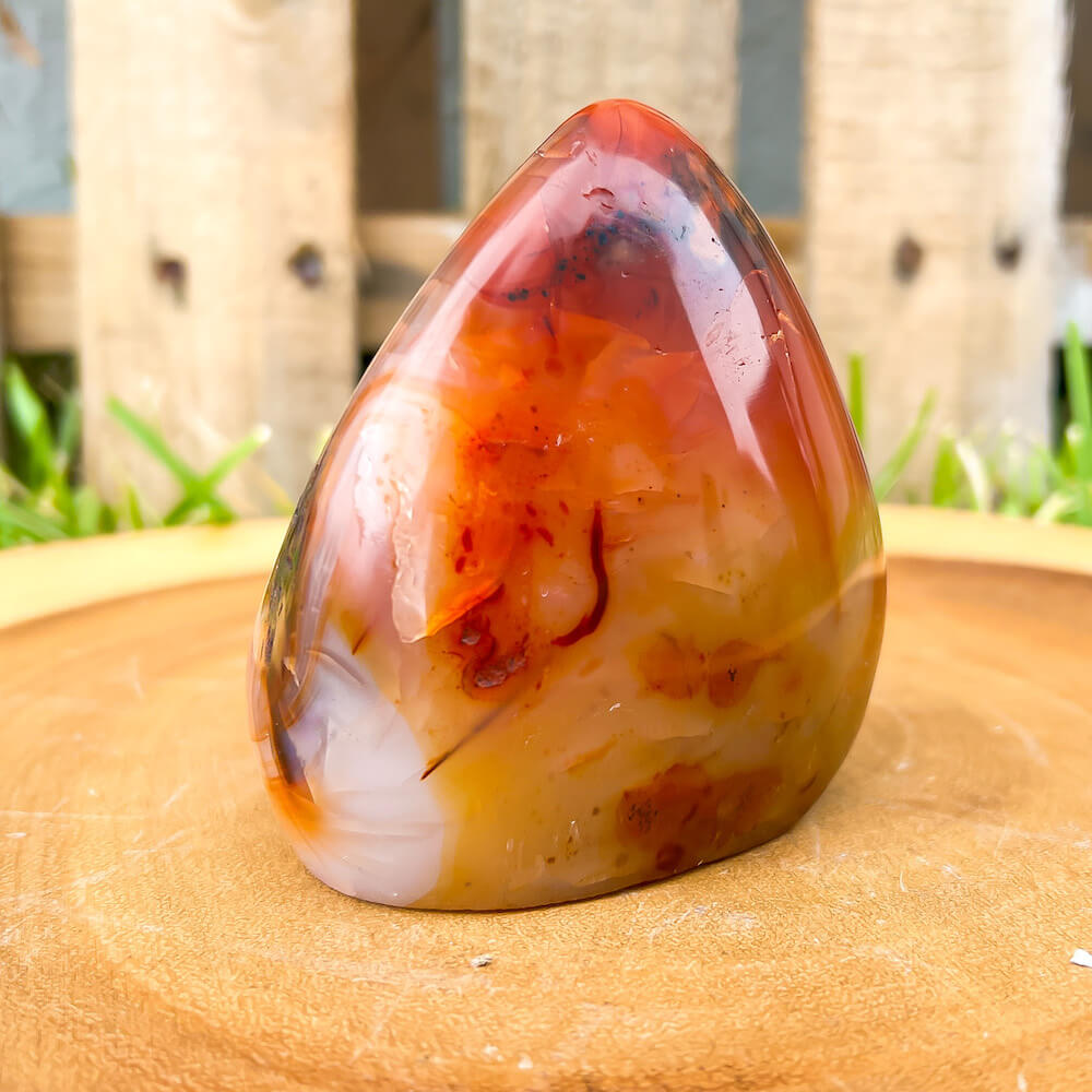 Looking for genuine and stunning Carnelian Free Form - #3 Shop at Magic Crystals for polished cut base carnelian. We only carry 'AAA' Quality Carnelian from India and Madagascar. Carnelian Crystal - Red Crystal - Tower for reiki Healing. Free Standing Crystal, Beautiful Display Crystal.