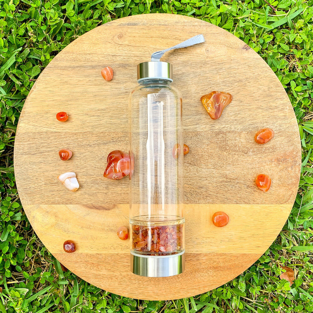 Looking for Authentic Tumbled Crystal Water Bottle | Glass and Stainless Steel Water Bottle? Shop at Magic Crystals for tumbled Carnelian healing crystals water bottles. 400 - 500 ml Tumbled Gemstone Unique Mineral Collection Gift. Gem Elixir Water Bottle with FREE SHIPPING AVAILABLE.