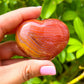 Looking for a genuine and stunning Carnelian Crystal Heart? Shop at Magic Crystals for Carnelian Heart - Orange Heart - Crystal Stone Heart. Extra-High Quality Carnelian Hearts. We only carry 'AAA' Quality Carnelian from Madagascar. Red Agate Crystal for Reiki Healing. Red Carnelian, Orange Carnelian, Authentic Crystal. Carnelian-Heart-F