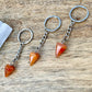 Carnelian Keychain. Carnelian is one of the most powerful crystals for vitality and motivation. Carnelian Single Point Keychain - Crystal keychain at Magic Crystals. Free shipping available. We carry a wide variety of keychains, gemstones, bracelets, earrings, and handmade jewelry. Carnelian gemstones.