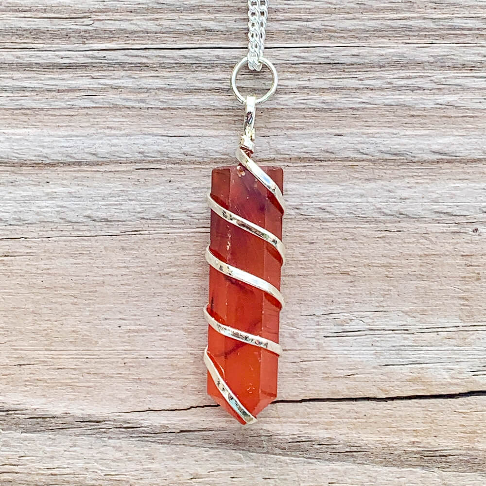 Buy  Orange Carnelian Necklace - Carnelian Gemstone Jewelry, Natural Carnelian Gemstone Single-Terminated Gemstone Points wrapped at Magic Crystals. Shop for carnelian jewelry with FREE SHIPPING AVAILABLE. Carnelian is best for Motivation. Spiral Wire Wrapped necklace. Wire-wrapped Carnelian Stone Necklace.