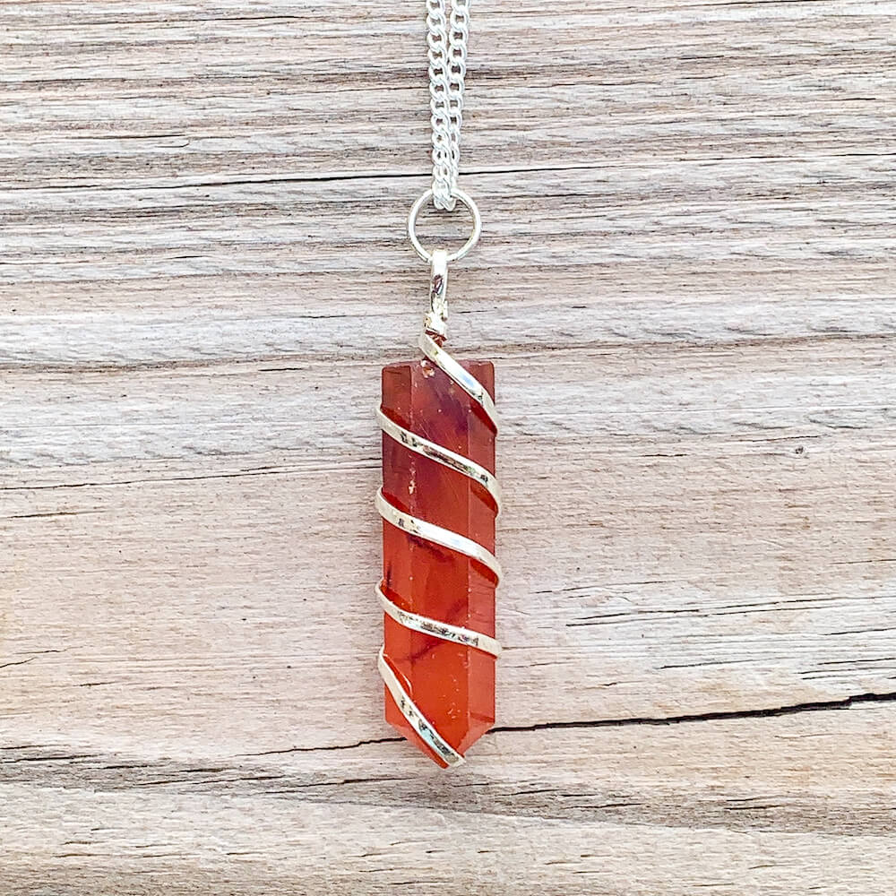 Buy  Orange Carnelian Necklace - Carnelian Gemstone Jewelry, Natural Carnelian Gemstone Single-Terminated Gemstone Points wrapped at Magic Crystals. Shop for carnelian jewelry with FREE SHIPPING AVAILABLE. Carnelian is best for Motivation. Spiral Wire Wrapped necklace. Wire-wrapped Carnelian Stone Necklace.
