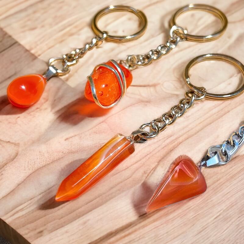 Carnelian keychain. Shop at Magic Crystals for Crystal Keychain, Pet Collar Charm, Bag Accessory, natural stone, crystal on the go, keychain charm, gift for her and him. Carnelian is a great for courage. Carnelian Natural Stone Keychain, Crystal Keychain, Carnelian Crystal Key Holder. Yellow gemstone.