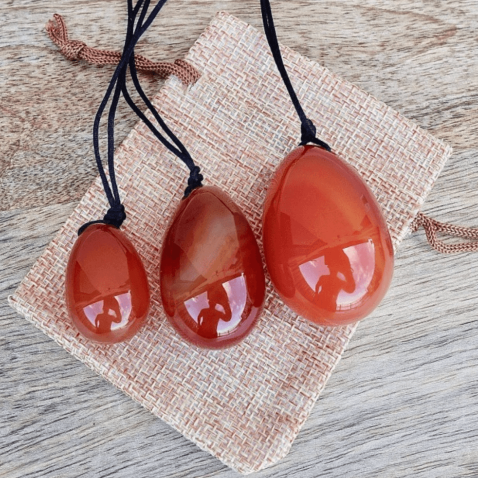 Carnelian Yoni Eggs Set. Free Shipping Available. Buy from Magic Crystals . Yoni Eggs 3-pcs Yoni Eggs Certified  jade eggs, Drilled, with String. Yoni Eggs are highly polished semi-precious gemstones carved especially for the female Yoni (vagina). Natural Yoni Eggs Set - Yoni Eggs drilled.