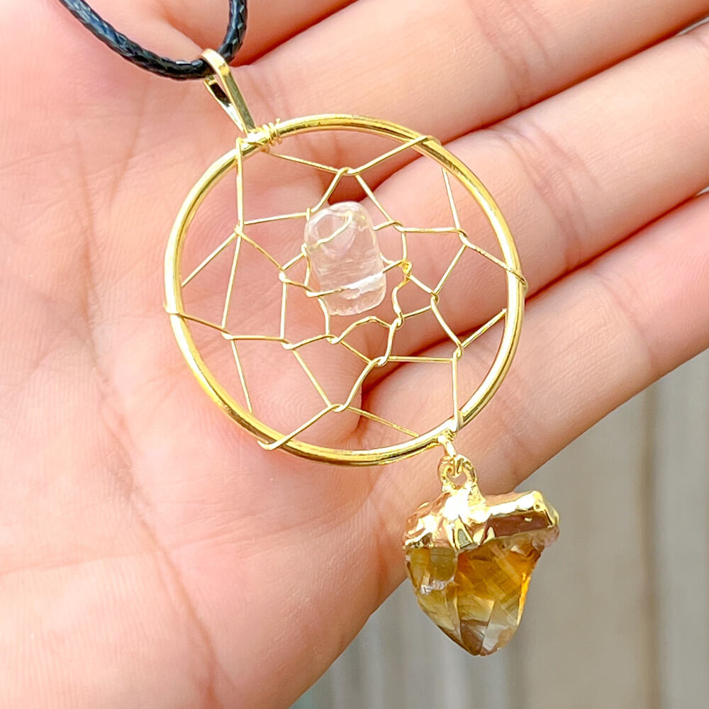 Gorgeous gold plated Citrine Dreamcatcher gold Necklace adorned with a clear quartz crystal bead and a raw Citrine crystal hanging from the bottom. Shop at Magic Crystals for Citrine Jewelry, Healing Crystals, and Stones. Perfect gift for someone or to wear every day. Boho Jewelry, February Birthstone.