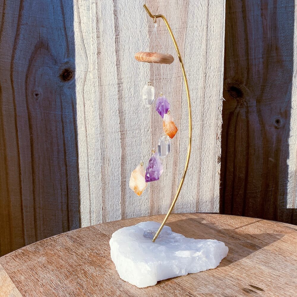 This beautiful 7 crystal point desk chime is made with genuine Clear Quartz, Amethyst, and Citrine crystals draping from a wooden ring. Desk Chime Home Decor at Magic Crystals with FREE SHIPPING available. perfect for office decor, crystal wind chime, crystal decor. Chime Mobile, Wind Catcher, Spiritual Art.