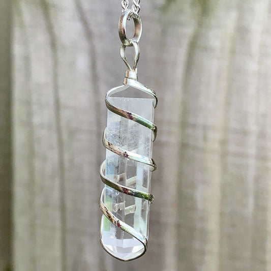 Buy Clear Quartz Necklace - Clear Quartz Gemstone Jewelry, Natural Clear Quartz Gemstone Single-Terminated Gemstone Points wrapped at Magic Crystals. Shop for Clear Quartz jewelry with FREE SHIPPING AVAILABLE. Clear Quartz is best for healing. Spiral Wire Wrapped necklace. Wire-wrapped Clear Quartz Stone Necklace.