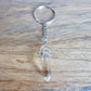 Clear Crystal Quartz keychain. Shop at Magic Crystals for Crystal Keychain, Pet Collar Charm, Bag Accessory, natural stone, crystal on the go, keychain charm, gift for her and him. Clear Crystal Quartz is a great for all hear. Clear Crystal Quartz Natural Stone Keychain, Crystal Keychain, Clear Crystal Quartz Crystal Key Holder. White clear gemstone.