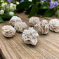 Shop Raw Desert Rose Selenite - Selenite Rose Cluster - Natural Selenite Crystal - Healing Crystals & Stones - Rough Gypsum Desert Rose Cluster at Magic Crystals. www.magiccrystals.com Sand Rose, Selenite Rose or Gypsum Rose, or gypsum rosettes. It is a form of gypsum when sand particles become embedded in it.