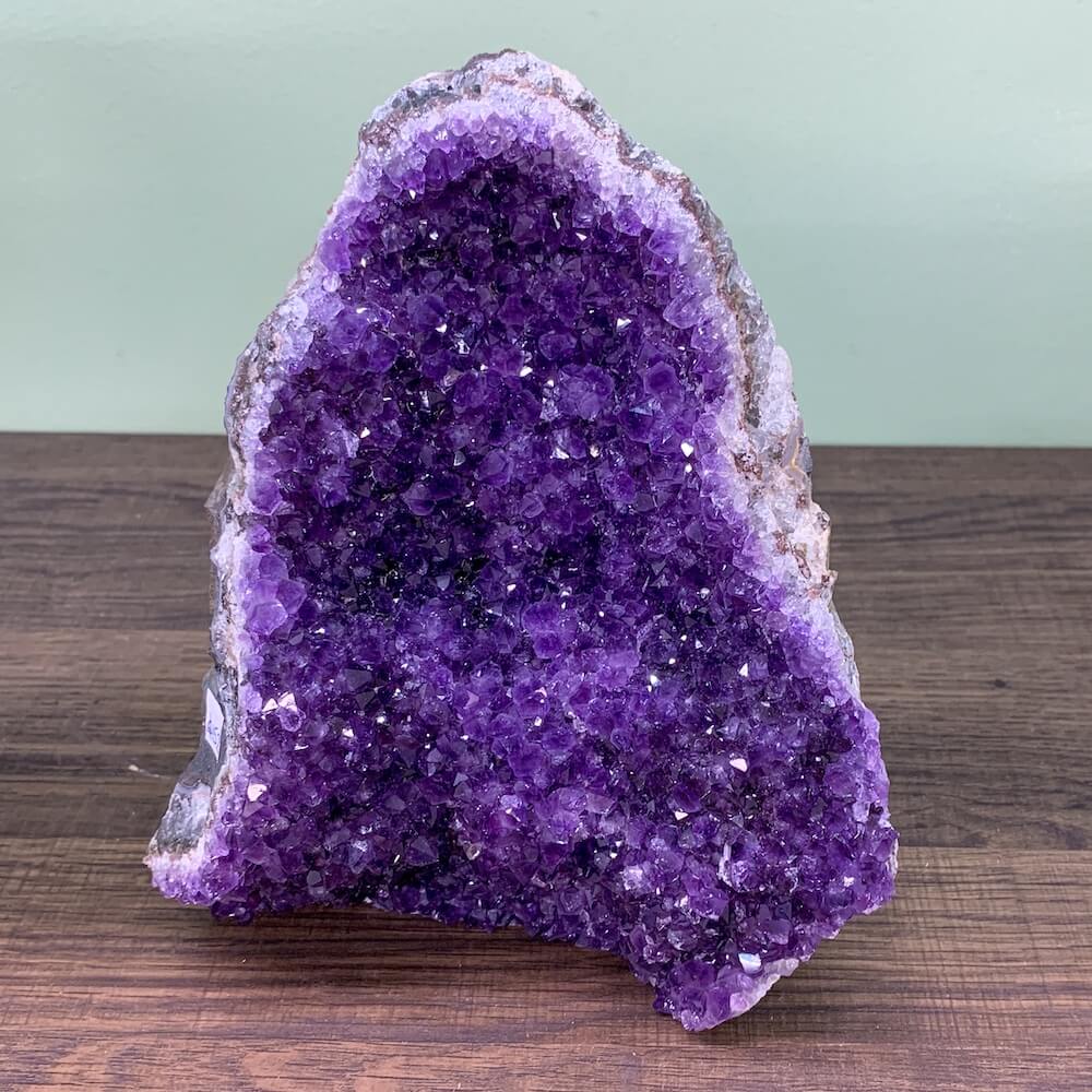 Buy Magic Crystals Raw Amethyst Druzy Cluster, Natural Crystal at Magic Crystals. This gemstone is a February Birthstone perfect for Third Eye Chakra and Crown. This gemstone helps for Anxiety, Spirituality, and Wisdom. Gifts at Magic Crystals. Natural Amethyst offers FREE SHIPPING and the best quality gemstones. 