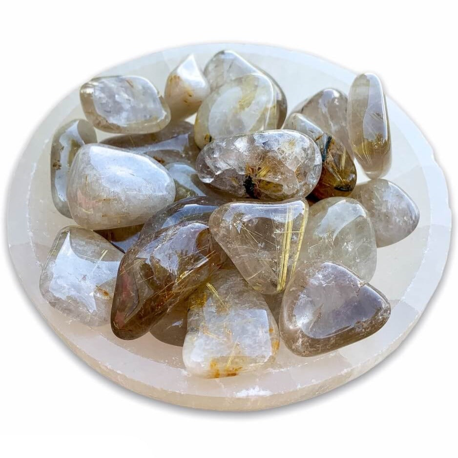 Buy Gold Rutilated Quartz Tumbled Stone - Gold Rutile crystals - Choose how many stones, Singles, or Bulk at Magic Crystals. FREE SHIPPING Crystal Gift, Gift, Gift for Friends, Gift for sister, Gift for Crystals Lovers at Magic Crystals. Golden rutile Quartz is known to aid in clarity, well-being, and willpower. 