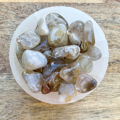 Buy Gold Rutilated Quartz Tumbled Stone - Gold Rutile crystals - Choose how many stones, Singles, or Bulk at Magic Crystals. FREE SHIPPING Crystal Gift, Gift, Gift for Friends, Gift for sister, Gift for Crystals Lovers at Magic Crystals. Golden rutile Quartz is known to aid in clarity, well-being, and willpower. 