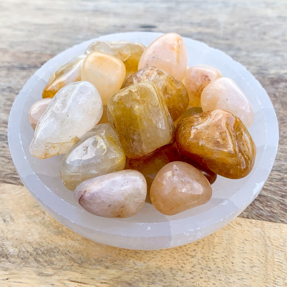 Buy Golden Healer Quartz Tumbled Stones | Golden Healer Quartz Polished Gemstones, Bulk Crystals at Magic Crystals. Golden Healer Quartz, known as A "Master Healer". Powerful for connecting with source energy. Connects the solar plexus chakra up to the Crown Chakra.