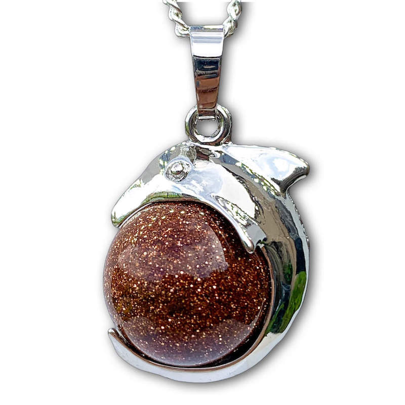 Goldstone-Sphere-Dolphin-Pendant-Necklace. Dolphin Necklace - Elegant Ocean-Themed Jewelry for Women Dolphin Charm Necklace at Magic Crystals. Boho Style Jewelry with Natural Gemstones. Stone Carved Dolphin Necklace Pendant, Beach Surf Ocean Boho Gemstone Whale Fairtrade Gift. These beautiful stone necklaces are all hand carved.
