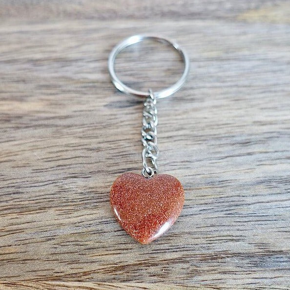 Goldstone Stone Heart Keychain. Shop at Magic Crystals for Crystal Keychain, Pet Collar Charm, Bag Accessory, natural stone, crystal on the go, keychain charm, gift for her and him. GoldStone is a great SPIRITUALITY. FREE SHIPPING available. GoldStone Crystal Key Chain, Crystal Keyring, GoldStone Crystal Key Holder