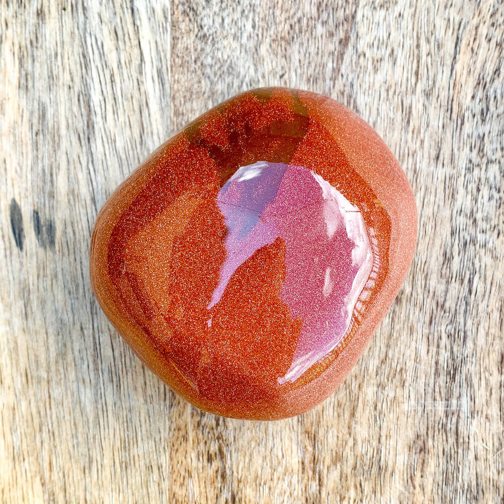 Looking for extra Large Tumbled Goldstone Stone - Large Palm Stone shop at MAGIC CRYSTALS. Goldstone is known as a protective warrior stone. It helps you get out of your head and back down to earth. Increases drive and confidence. Goldstone promotes vitality.