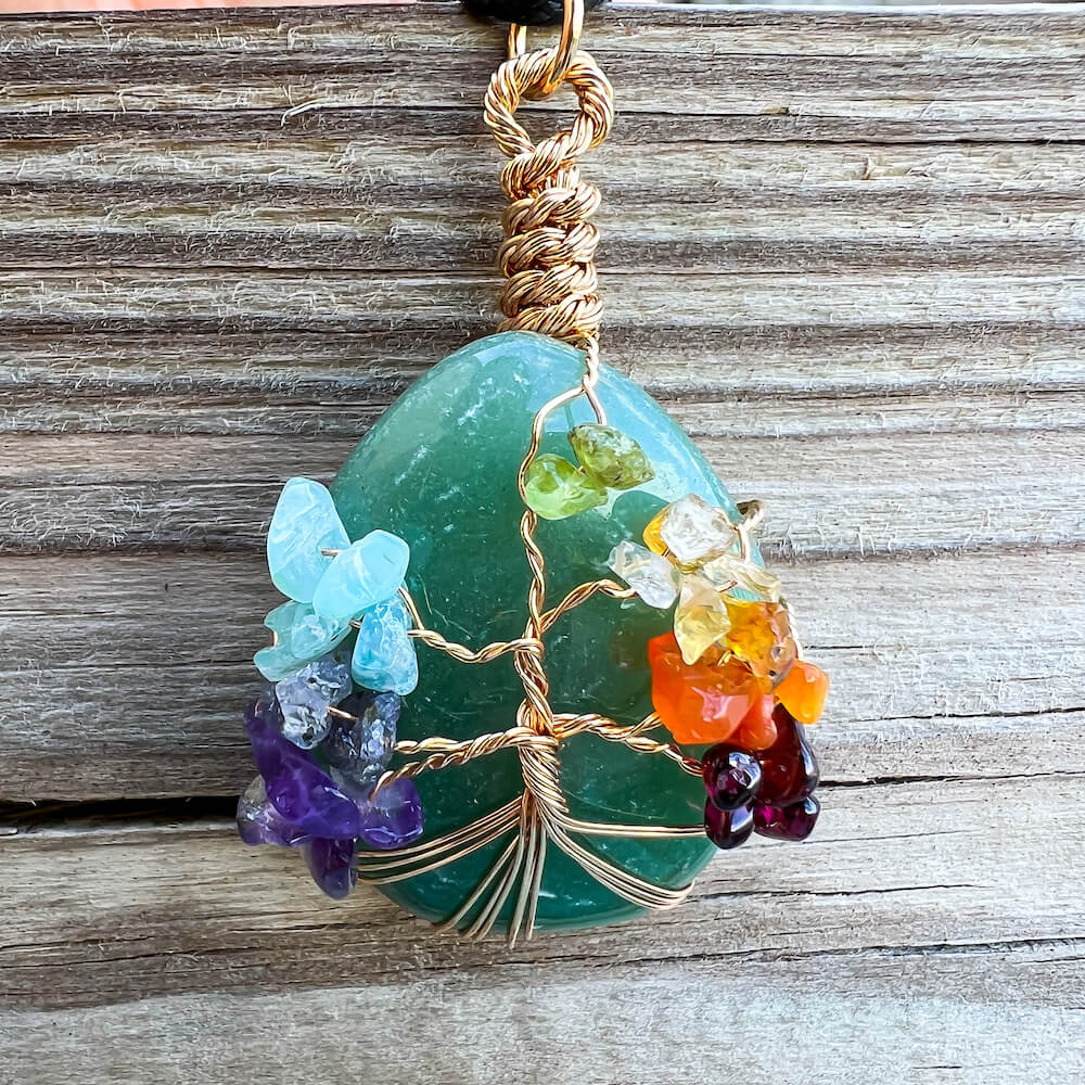 Green-Aventurine-Tree-Of-Life-Chakra-Necklace. Looking for a gift for mother/her, tree of life necklace, stone necklace, pendant? Shop at Magic Crystals for a 7 Chakra Tree Of Life Drop Necklace. 7 Chakra necklaces, and seven chakras jewelry pieces. Handmade Natural Amethyst Crystal. Amethyst Drop shape, teardrop, Protection Necklaces.
