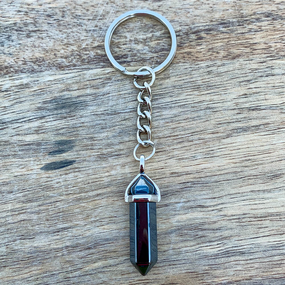 Hematite KEYCHAIN. Shop at Magic Crystals for Crystal Keychain, Pet Collar Charm, Bag Accessory, natural stone, crystal on the go, keychain charm, gift for her and him. Hematite is a great SPIRITUALITY. FREE SHIPPING available. Hematite Crystal Key Chain, Crystal Keyring, Hematite Crystal Key Holder. Gray stone keys.