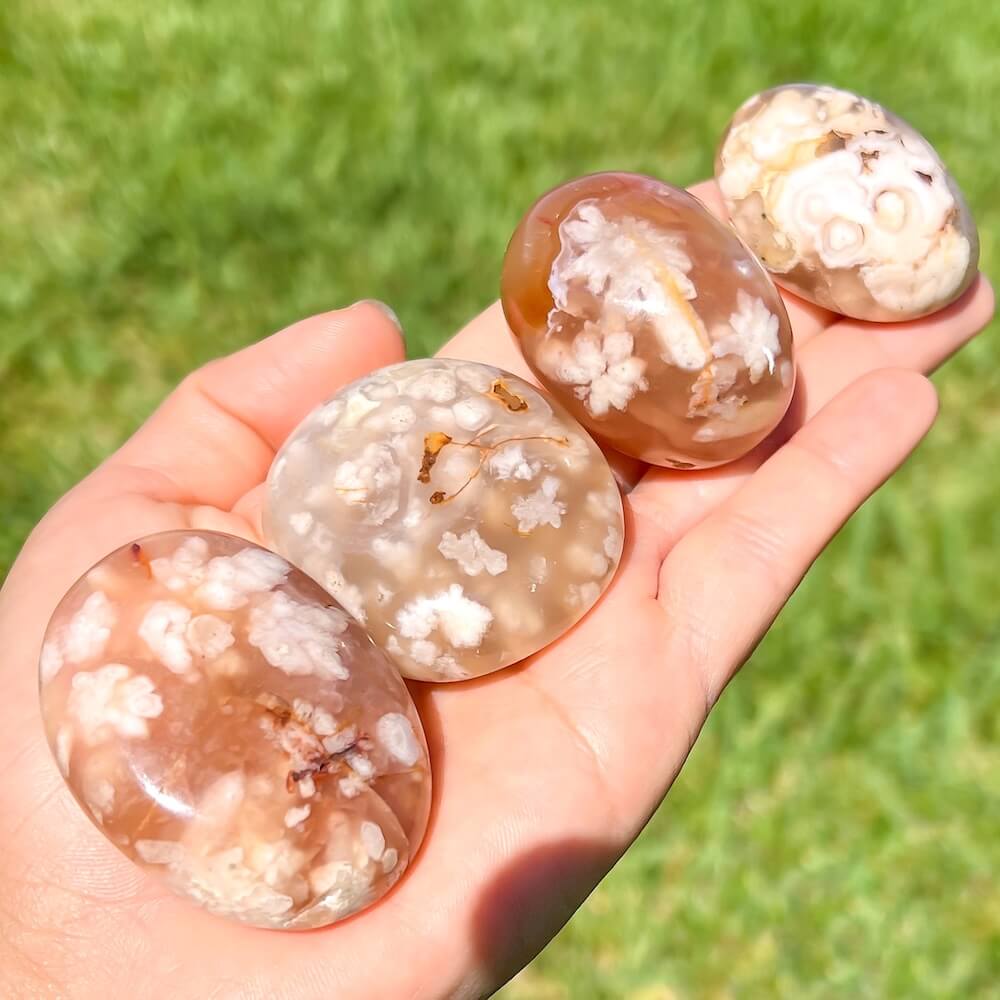 Looking for Flower Agate Gallet? Shop for Flower Agate palm stone - Cherry Blossom Agate Palm Stone at Magic Crystals. Flower agate stone carving, Agate flower tumbled stone, Cherry Blossom stone. FREE SHIPPING available. Flower agate can be used to bloom the feminine side. High-Quality PALM GEMSTONE .Sakura Agate