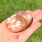 Looking for Flower Agate Gallet? Shop for Flower Agate palm stone - Cherry Blossom Agate Palm Stone at Magic Crystals. Flower agate stone carving, Agate flower tumbled stone, Cherry Blossom stone. FREE SHIPPING available. Flower agate can be used to bloom the feminine side. High-Quality PALM GEMSTONE .Sakura Agate