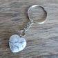 Howlite keychain. Shop at Magic Crystals for Crystal Keychain, Pet Collar Charm, Bag Accessory, natural stone, crystal on the go, keychain charm, gift for her and him. Howlite is a great for vitality. Howlite Natural Stone Keychain, Crystal Keychain, Howlite Crystal Key Holder. White gemstone.