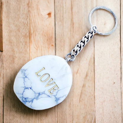 Howlite keychain. Shop at Magic Crystals for Crystal Keychain, Pet Collar Charm, Bag Accessory, natural stone, crystal on the go, keychain charm, gift for her and him. Howlite is a great for vitality. Howlite Natural Stone Keychain, Crystal Keychain, Howlite Crystal Key Holder. White gemstone.