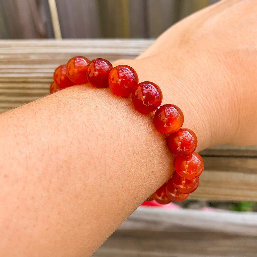 Looking for Natural Carnelian Gemstone Beaded Bracelet? Shop at Magic Crystals for Carnelian Jewelry. Large Carnelian Gemstone Bracelet with 10 mm beads. Carnelian for root Sacral Chakra and Virgo Zodiac. FREE SHIPPING available. Carnelian Beads 6mm and 8mm stone elastic unisex bracelets.