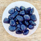 Buy Iolite Tumbled Stones, Iolite Polished Gemstone, Healing Stone, Bulk Crystals at Magic Crystals. Iolite is a motivational gemstone that helps you to organize your life path, achieve your goals and dreams through determination & focus, keeps you eager for success in life, and will help you to better manage your financial life.