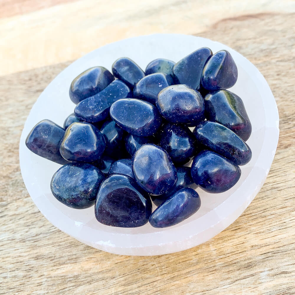 Buy Iolite Tumbled Stones, Iolite Polished Gemstone, Healing Stone, Bulk Crystals at Magic Crystals. Iolite is a motivational gemstone that helps you to organize your life path, achieve your goals and dreams through determination & focus, keeps you eager for success in life, and will help you to better manage your financial life.