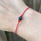    Kabbalah-jet-azabache-protection-Bracelet.Shop at Magic Crystals for Protection. The Red String Bracelet has been worn throughout history in many cultures as a symbol of protection, faith, and good luck and acts as a shield from negativity and actually has many positive effects. In quite a few cultures a red string bracelet is believed to have magical powers.