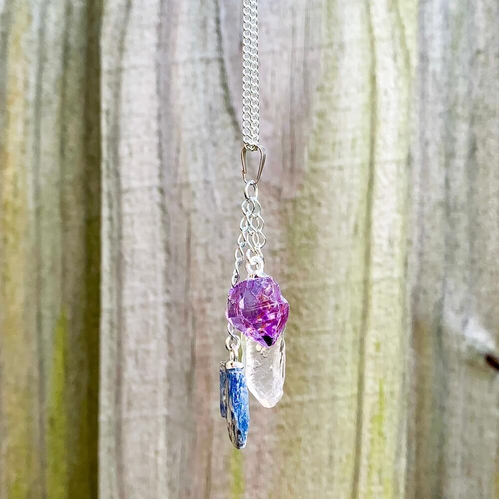 This beautiful Amethyst Blue Kyanite and Quartz Pendant Necklace are made with genuine gemstones. Magic crystals offer free shipping. Blue Kyanite opens the throat chakra, encouraging communication and self-expression. Clear quartz is said to be a master healing stone. Amethyst is a natural tranquilizer.