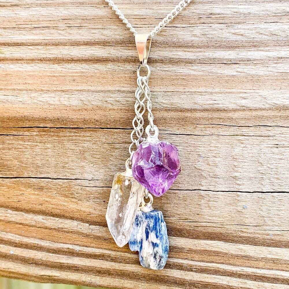 This beautiful Amethyst Blue Kyanite and Quartz Pendant Necklace are made with genuine gemstones. Magic crystals offer free shipping. Blue Kyanite opens the throat chakra, encouraging communication and self-expression. Clear quartz is said to be a master healing stone. Amethyst is a natural tranquilizer.