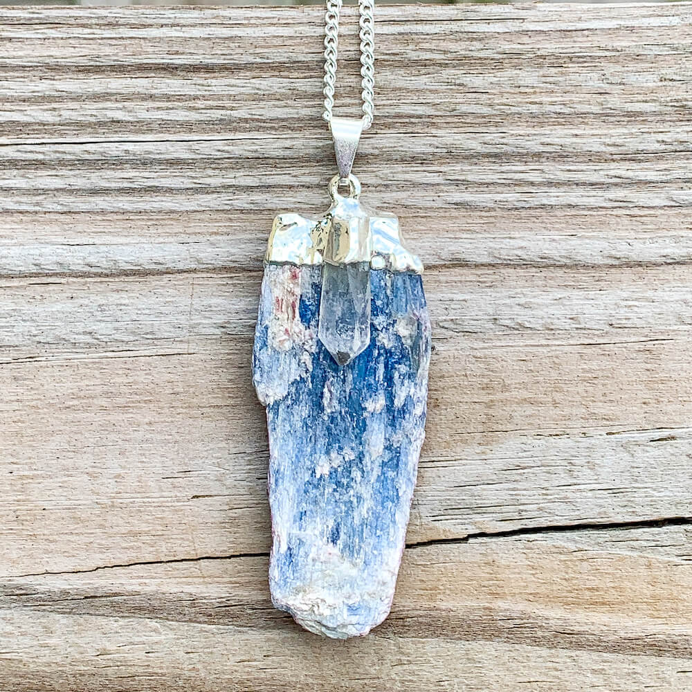 Blue Kyanite Necklace. Shop for handmade Raw Kyanite Pendant Clear Quartz Necklace - Raw Kyanite Jewelry at Magic Crystals. Blue Crystal Necklace are perfect for men or women. Raw Crystal Necklace - Raw Stone Necklace - Bohemian Pendant with FREE SHIPPING available. Christmas gift, birthday present.