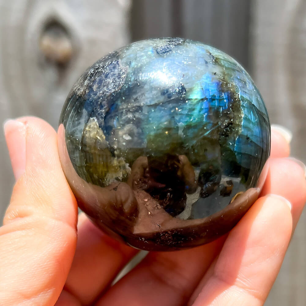 Labradorite-Sphere. Looking for Natural Labradorite Sphere? Magic Crystals labradorite gemstones. Natural Labradorite Sphere - B, Labradorite Ball, Undrilled Labradorite Crystal Ball. Labradorite Healing Crystal. Empathetic, supporting, and glowing with soft, this Labradorite is a wonderful crystal gift for someone you love.