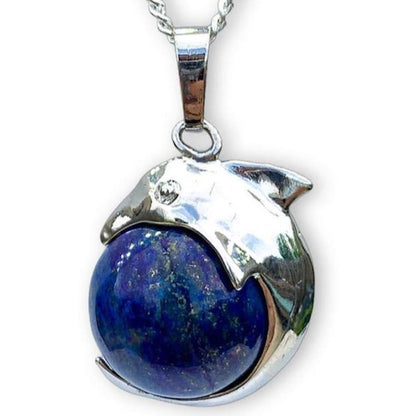    Lapis-Lazuli-Sphere-Dolphin-Pendant-Necklace. Dolphin Necklace - Elegant Ocean-Themed Jewelry for Women Dolphin Charm Necklace at Magic Crystals. Boho Style Jewelry with Natural Gemstones. Stone Carved Dolphin Necklace Pendant, Beach Surf Ocean Boho Gemstone Whale Fairtrade Gift. These beautiful stone necklaces are all hand carved.
