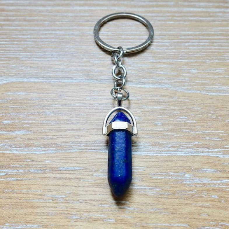 Lapis Lazuli  keychain. Shop at Magic Crystals for Crystal Keychain, Pet Collar Charm, Bag Accessory, natural stone, crystal on the go, keychain charm, gift for her and him. Lapis Lazuli  is a great for vitality. Lapis Lazuli  Natural Stone Keychain, Crystal Keychain, Lapis Lazuli  Crystal Key Holder. Blue gemstone.