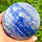Buy Natural lapis lazuli sphere at Magic Crystals. Natural Lapis Lazuli Sphere - Throat & Third-Eye Chakra - Lapis Lazuli Stone for ORDER • FOCUS • COMMUNICATION. Carry lapis lazuli Stones with you and pull them out whenever you need to center yourself or bring your attention back into focus.    Lapis-Lazuli-Sphere-A
